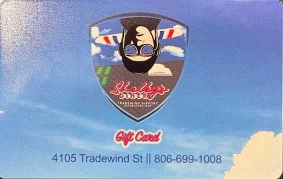 Shelby's Diner Gift Card with logo, address, and phone number on a blue sky background.